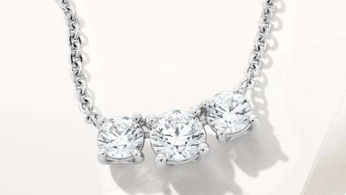 Three-stone diamond necklace. Shop diamond jewelry