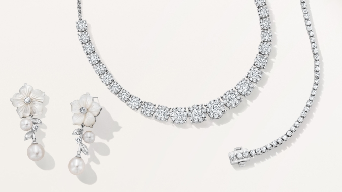 Pearl floral dangle earrings, diamond riveria and diamond tennis bracelet