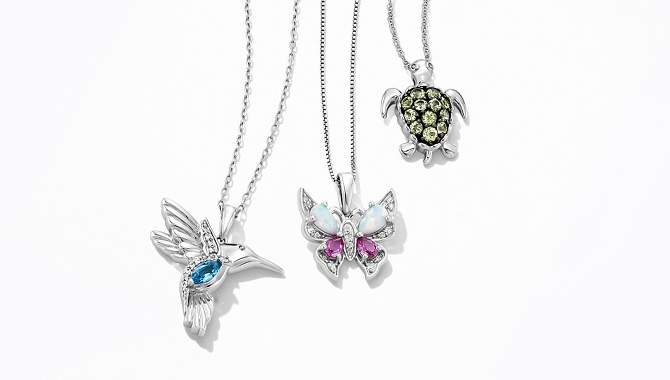 Image of gemstone hummingbird, butterfly, and turtle necklaces